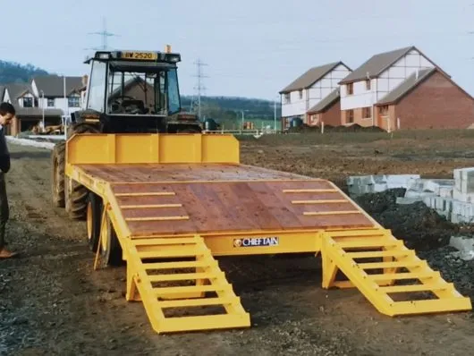 Early Chieftain low loader trailer on a building site