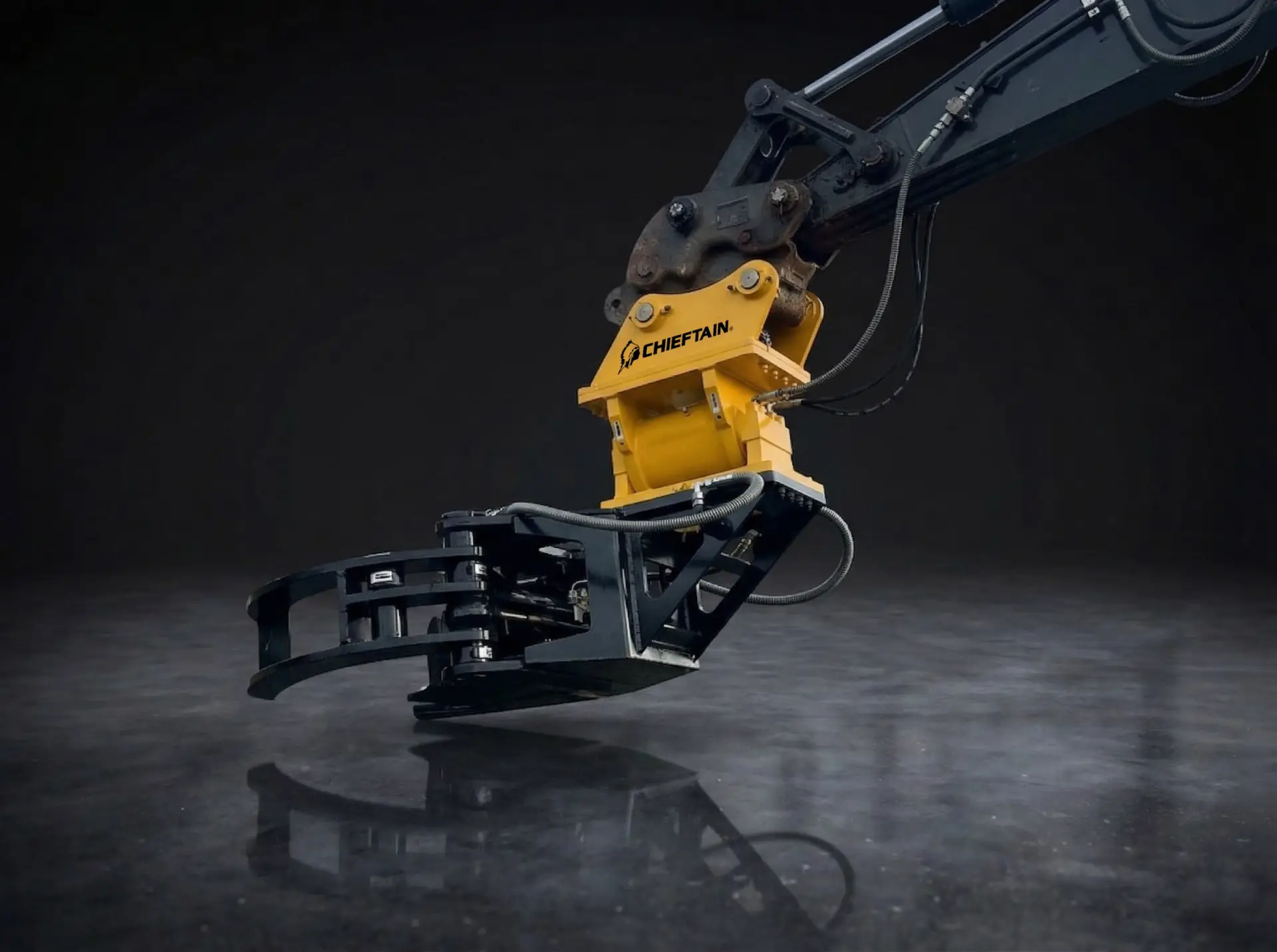 Chieftain yellow excavator grapple attachment on a dark background