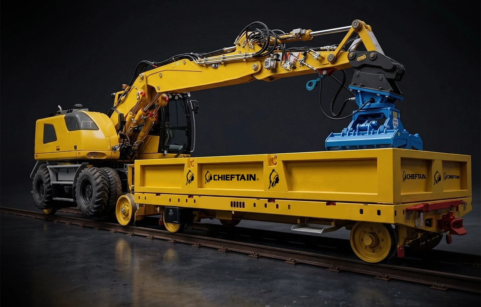 Chieftain yellow rail trailer with road-rail excavator on track